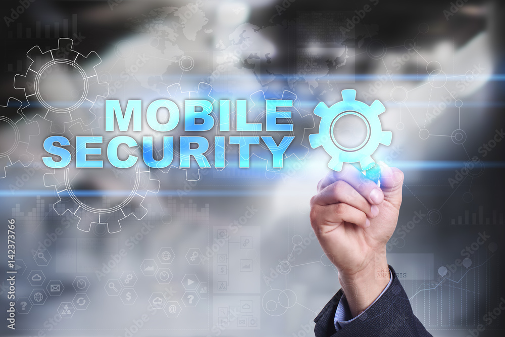 Businessman is drawing on virtual screen. mobile security concept. Businessman is drawing on virtual screen. mobile security concept.