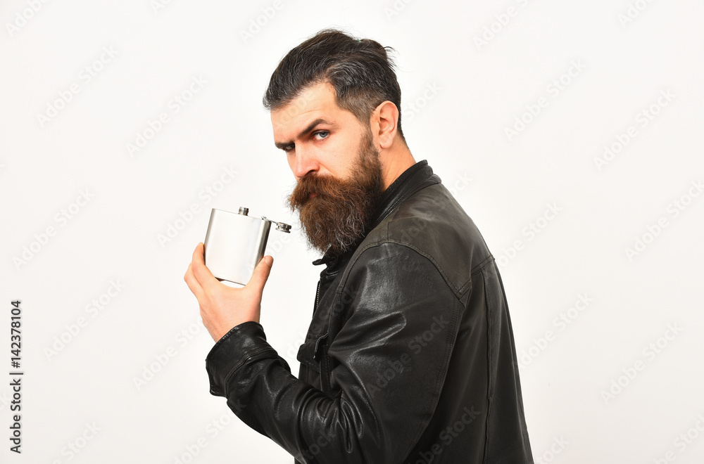serious bearded man hipster with metallic jar in leather jacket serious bearded man hipster with metallic jar in leather jacket