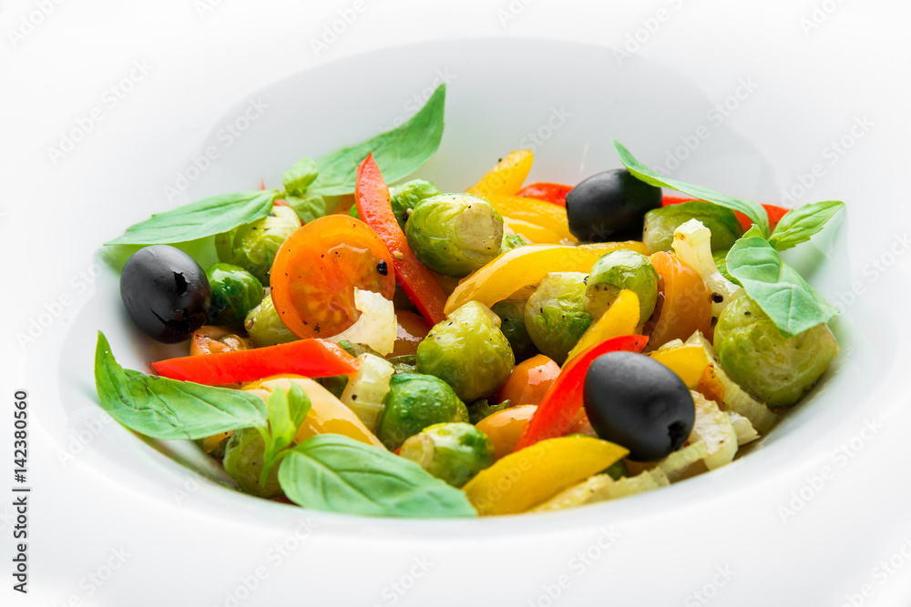 Salad of fried Brussels sprouts, paprika and olives