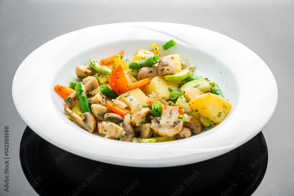 Hot salad with fried potatoes, mushrooms and asparagus Hot salad with fried potatoes, mushrooms and asparagus