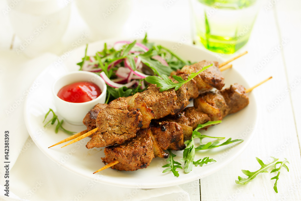 Beef shish kebab on skewers in curry. Beef shish kebab on skewers in curry.
