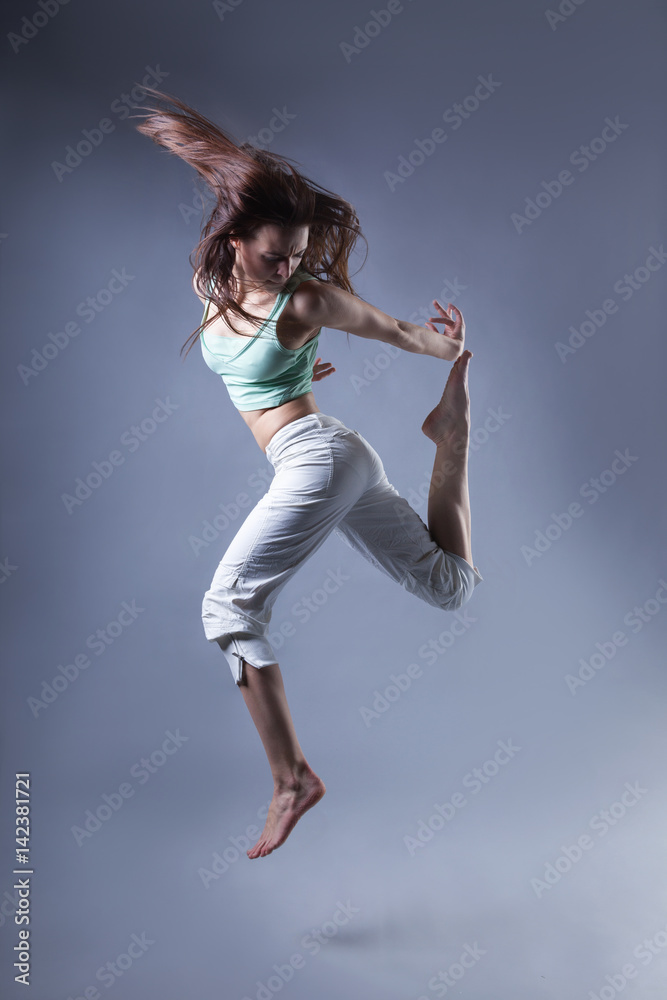 beauty girl dance on grey background