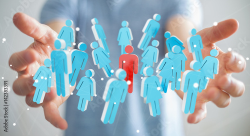 Businessman holding 3D rendering group of people in his hand