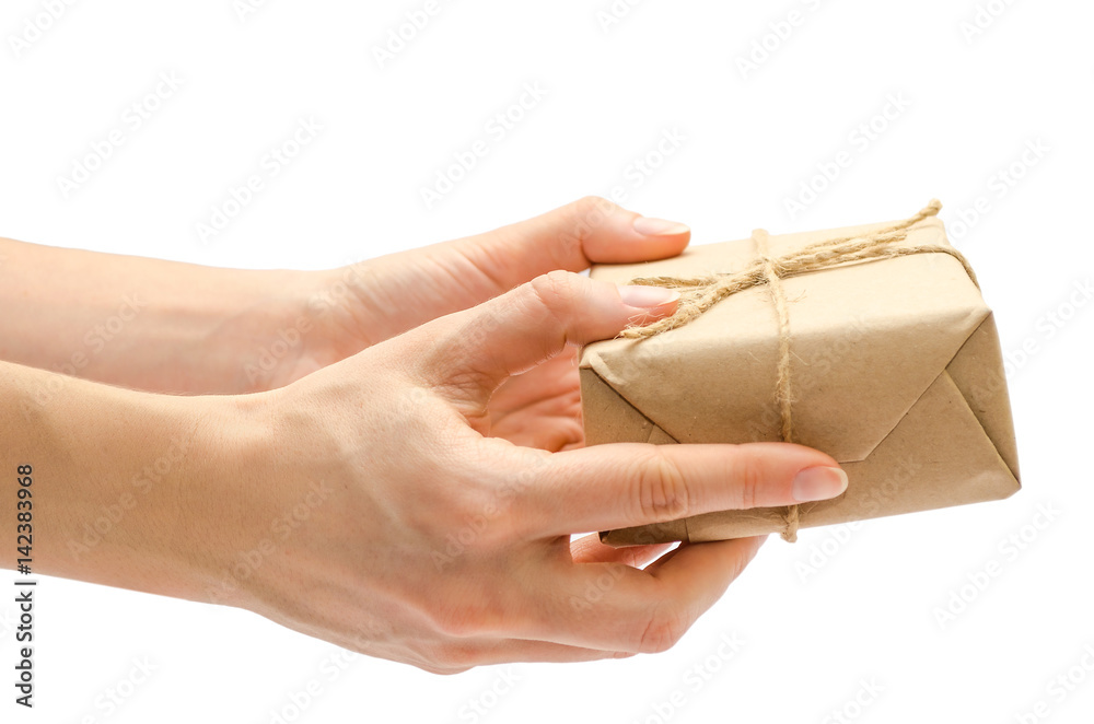 Obraz premium female hand holding gift box.