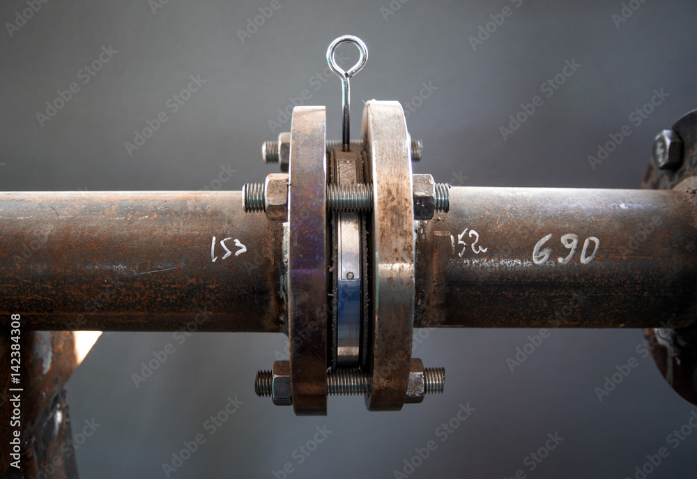 Flanged connection on pipe with plug close up Flanged connection on pipe with plug close up