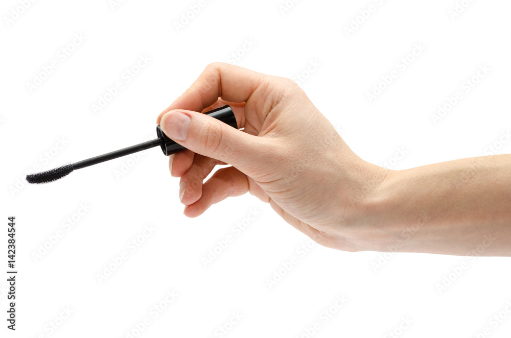 woman hand holding eyelash brush. woman hand holding eyelash brush.