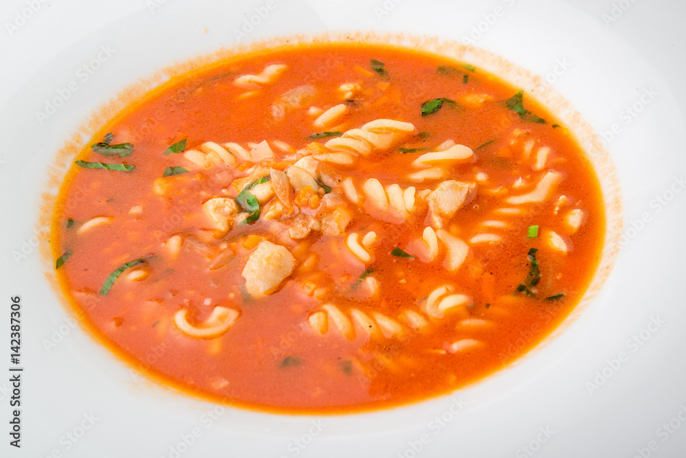 tomato soup with pasta on the plate tomato soup with pasta on the plate