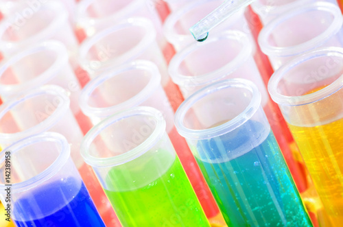 Plastic laboratory chemical test tubes with colorful solution