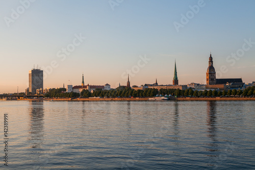Old town of Riga summer sunset skyline with Daugava river