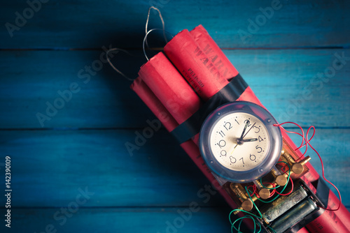 High contrast image of a timebomb on a wooden background