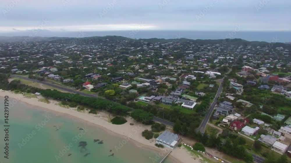 Smooth cinematic aerial turn above Sorrento Long pier revealing the suburb and coastline. Mornington Peninsula, Victoria, Australia Smooth cinematic aerial turn above Sorrento Long pier revealing the suburb and coastline. Mornington Peninsula, Victoria, Australia