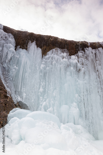 Urlatoarea waterfall on Ciucas mountains. winter view, Brasov. Romania photo