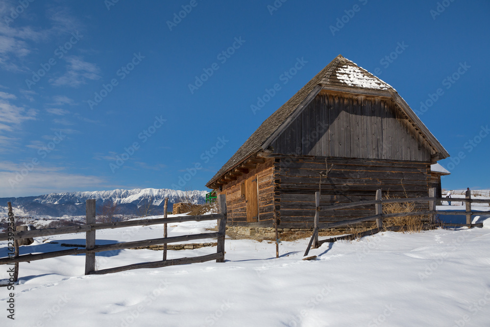 Winter in Transylvania (Romania) Old traditional countryside house in winter