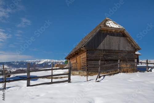 Winter in Transylvania (Romania) Old traditional countryside house in winter © Constantin