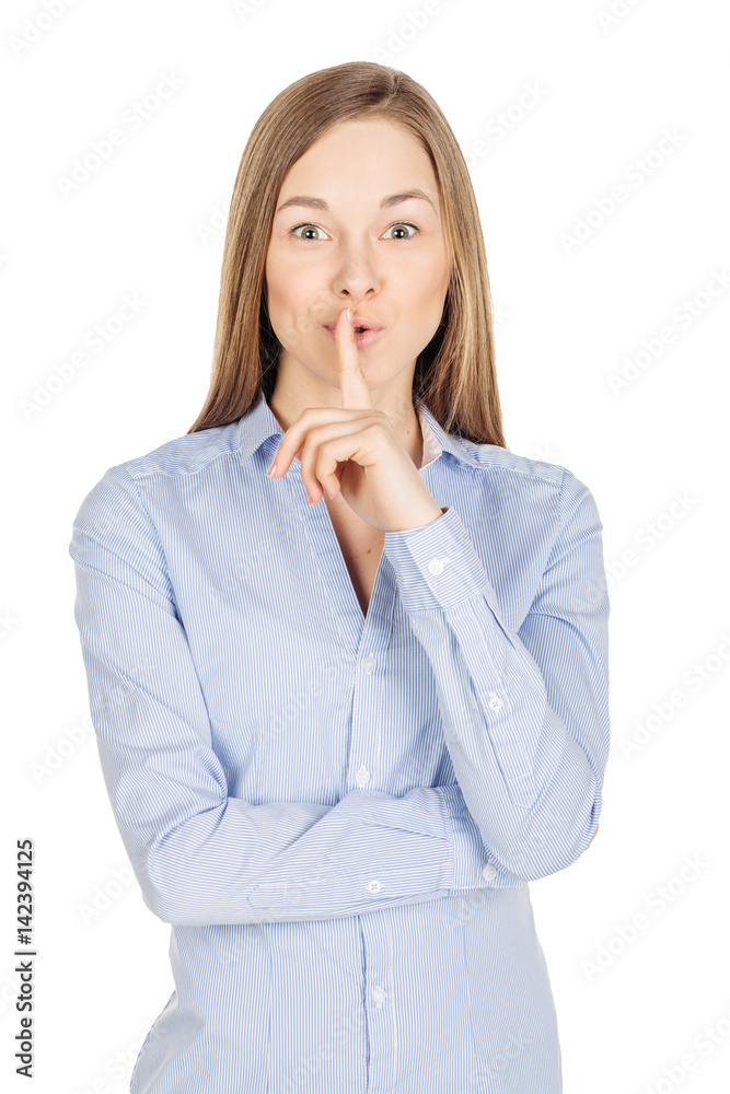 woman showing hand silence sign, asking someone to keep it quiet. human emotion expression and lifestyle concept. image on a white studio background. woman showing hand silence sign, asking someone to keep it quiet. human emotion expression and lifestyle concept. image on a white studio background.