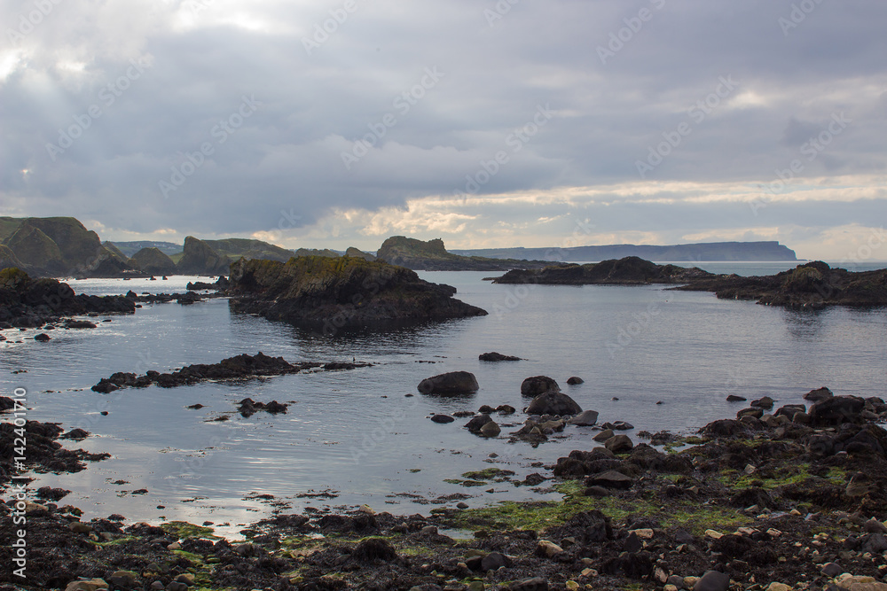 The rocky coastline overlooking Whitepark Bay to the north from Ballintoy harbor on the North Antrim coast in Northern Ireland