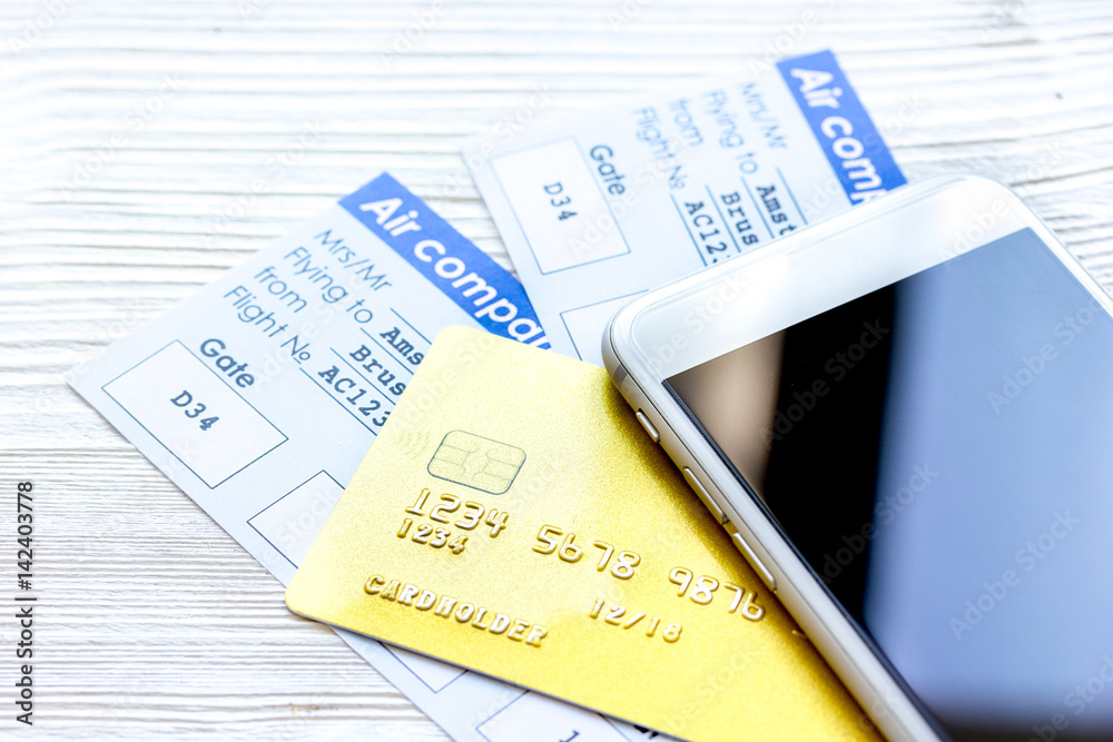 Credit cards with airline tickets for vacations on table background Credit cards with airline tickets for vacations on table background