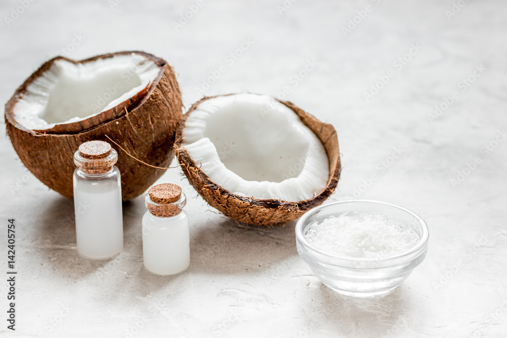 fresh coconut with cosmetic oil in jar on white background fresh coconut with cosmetic oil in jar on white background