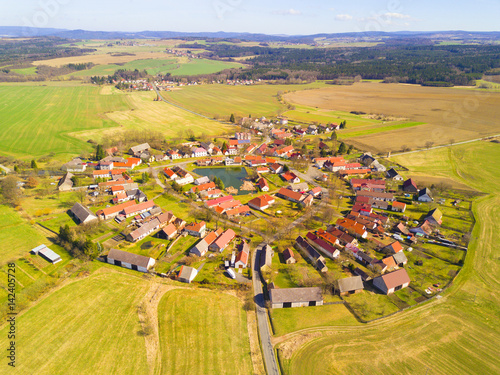 Aerial view of beautiful village in spring countryside. Old village Lipnice in Brdy, Czech republic. Rundling is a form of circular village. Typical medieval settlement. photo