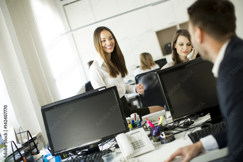 Business partners working in modern office Business partners working in modern office