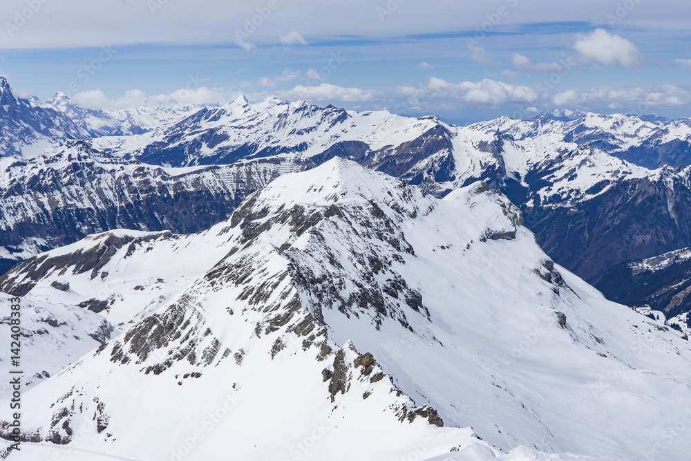 Landscape of Jungfrau Mountain Range in Switzerland, View of the Eiger, Monch and Jungfrau peaks from the Schilthorn (Piz Gloria), Lauterbrunnen, Bernese Alps, Switzerland, Europe, selective focus