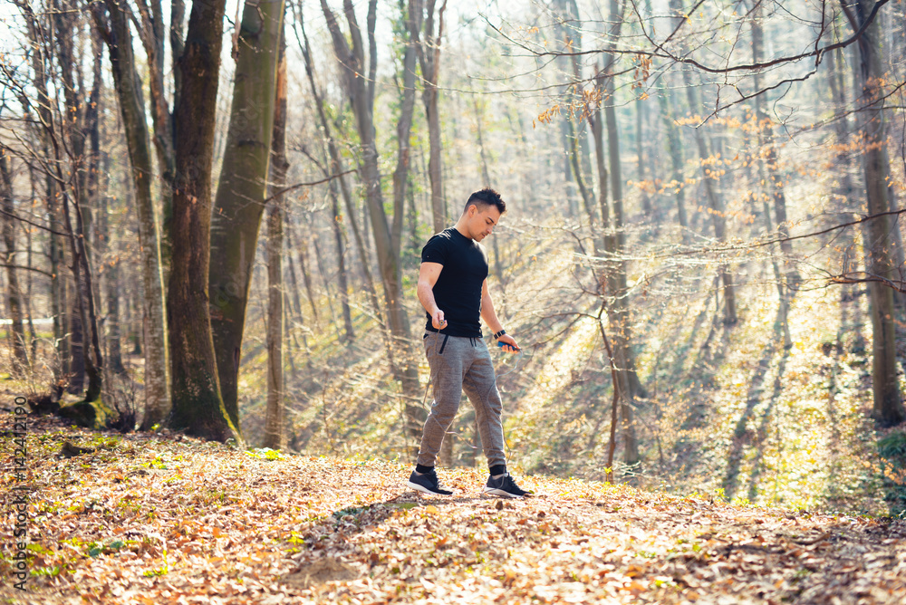 A man exercise in nature with rope A man exercise in nature with rope