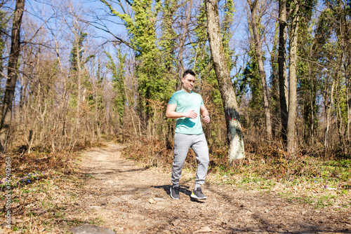 Man jogging in forest © Jovan