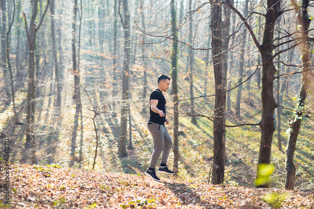 Muscular man skipping rope