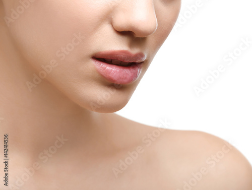 Face of young woman on white background