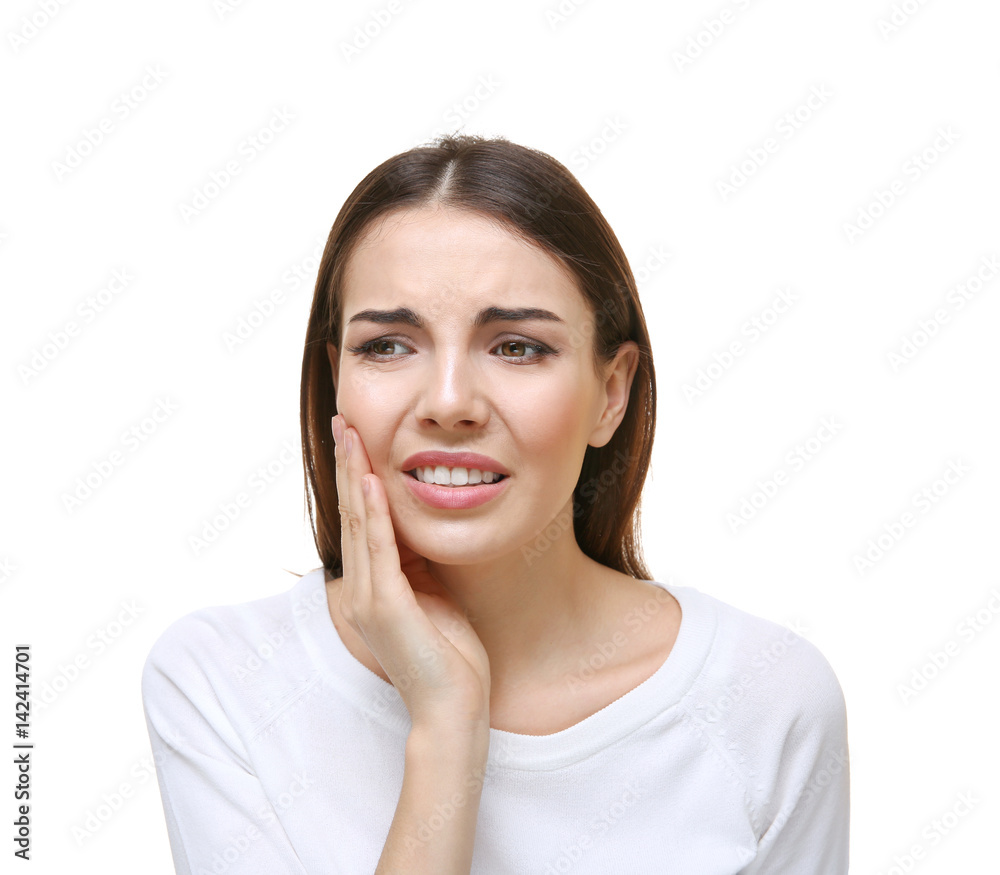 Beautiful young woman suffering from toothache on white background Beautiful young woman suffering from toothache on white background