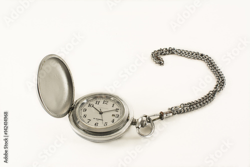Old pocket watch with an open lid