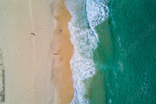 Aerial view of splashing sea waves and beach at Gold Coast.