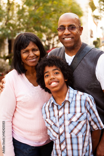 African American father and son spending with grandmother.