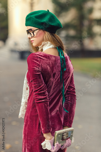 Fashion portrait of college student girl at campus outdoors © Buyanskyy Production