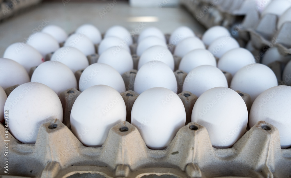 Obraz premium White eggs in tray sold at local farm market
