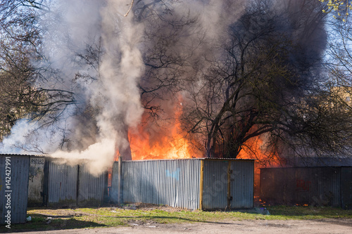 Action of fire extinguishing by firefighters in makeshift garages in Poland