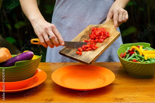culinary workshop. Vegetable salad with own hands in the courtyard of a private house.