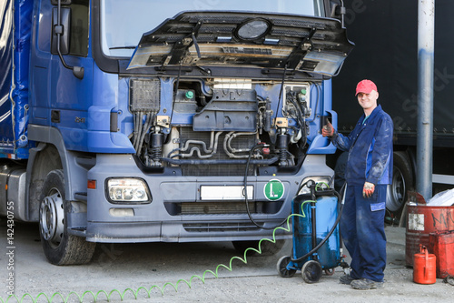 Mechanic repairing truck