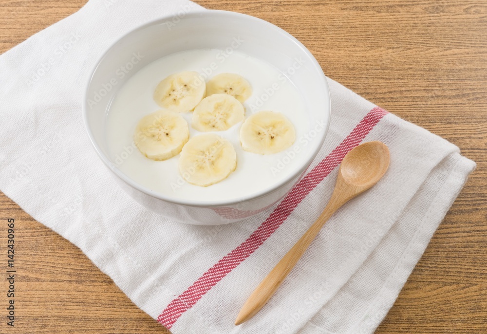 Bowl of Homemade Yoghurt with Ripe Banana Bowl of Homemade Yoghurt with Ripe Banana
