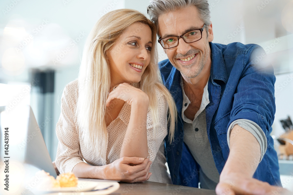 Portrait of happy middle-aged couple at home Portrait of happy middle-aged couple at home