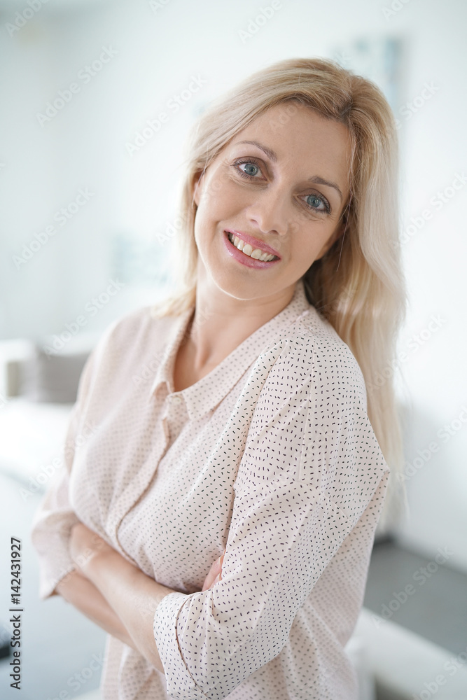 Portrait of beautiful blond woman standing at home Portrait of beautiful blond woman standing at home