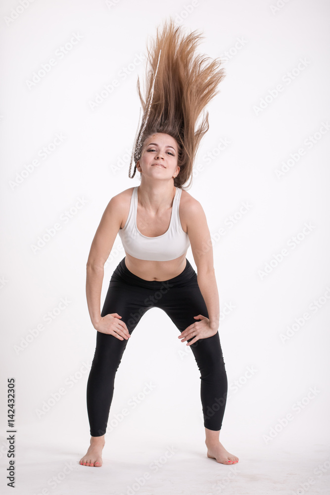 Slim sporty girl with long blond hair