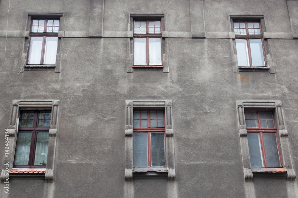 Fototapeta premium The facade of the old house with windows