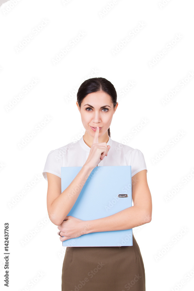 Young business woman in business clothes having a secret and making a hush gesture. Isolated Young business woman in business clothes having a secret and making a hush gesture. Isolated