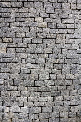 gray bricks wall texture, location - Wellington, New Zealand statue near the Parlament building