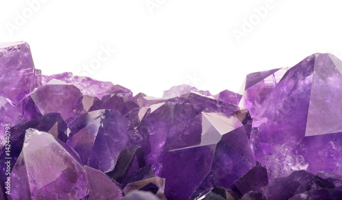 lilac amethyst crystals closeup on white