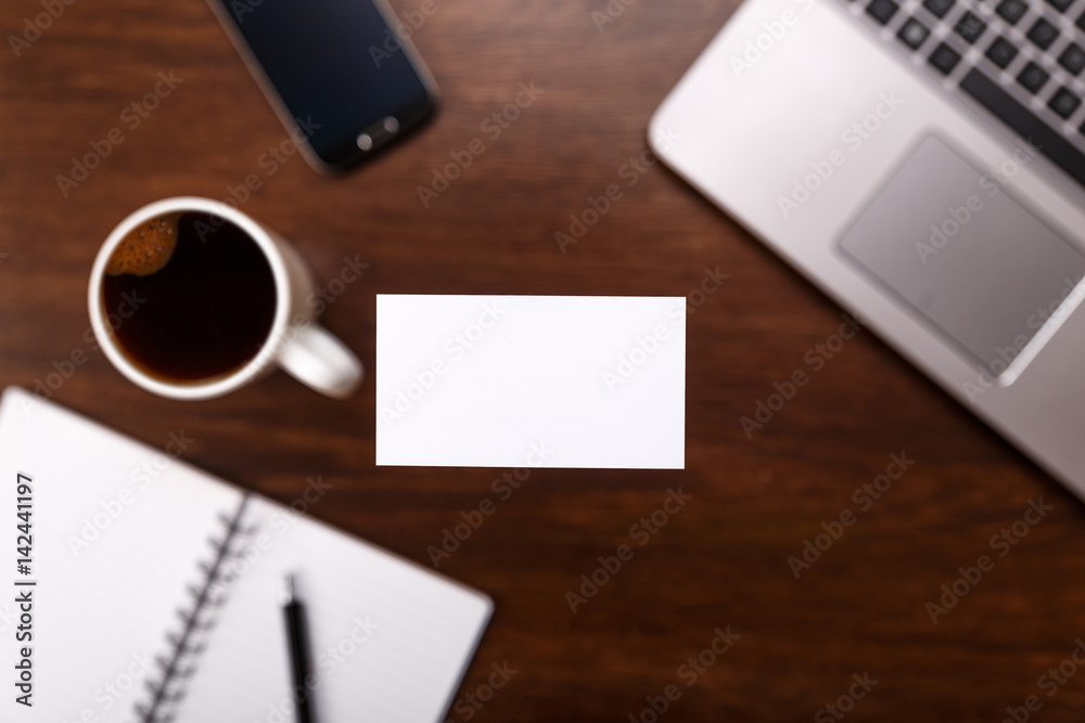 Blank business card design mockup. Visiting card, smartphone and laptop. Business branding template. Cup of coffee. Blank business card design mockup. Visiting card, smartphone and laptop. Business branding template. Cup of coffee.