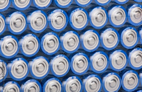 background from blue rows of batteries