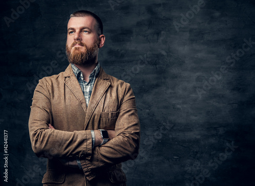 Studio portrait of redhead bearded male.