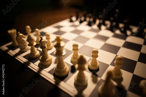 White and black pieces on chess board